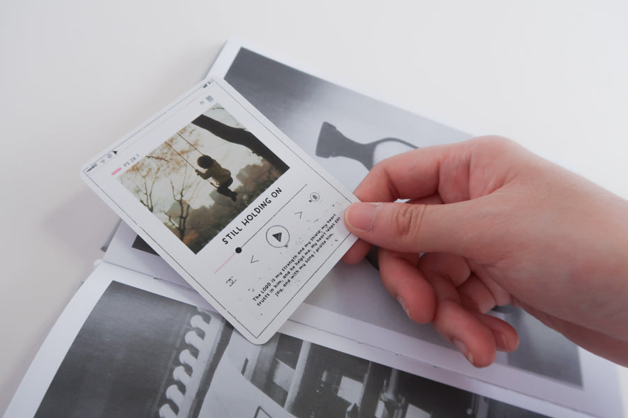 Bible verse scratch card used in a book for daily encouragement