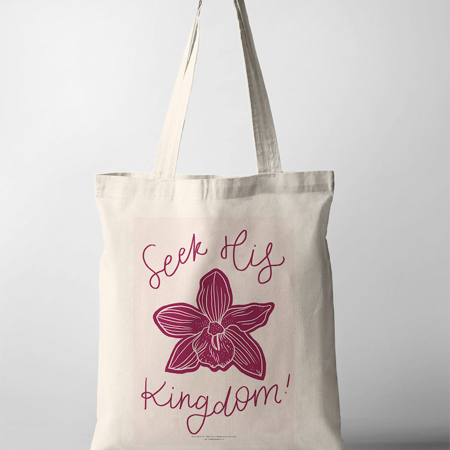 Christian tote bag featuring “Seek His Kingdom” with a pink background and orchid illustration