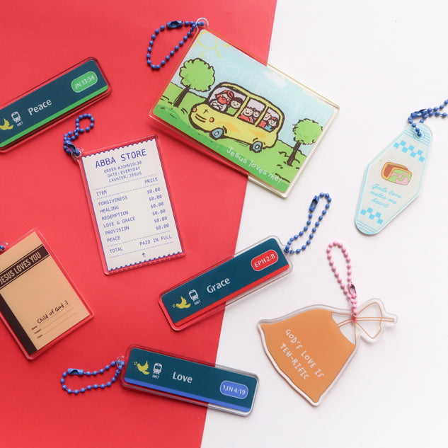Singapore-inspired Christian acrylic keychain collection featuring Jesus Loves Me, Abba Store, Grace, Love, Peace, God’s Love Is Extra Gao, and God’s love melts my heart designs
