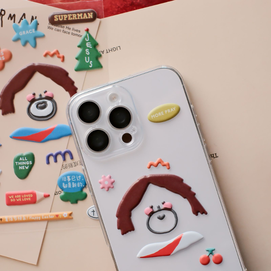 Phone decorated with Soft Jesus stickers, featuring a playful Jesus design and inspirational elements.