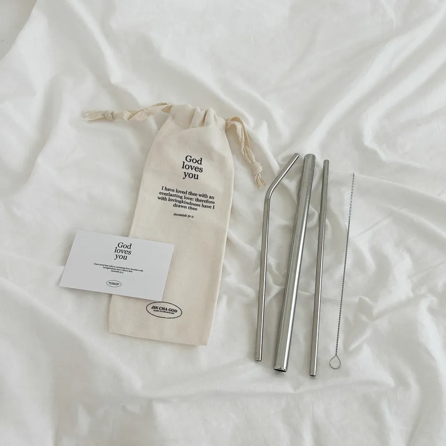 Stainless steel straw set with a canvas pouch featuring the message "God loves you" and a Bible verse from Jeremiah 31:3, including a cleaning brush.