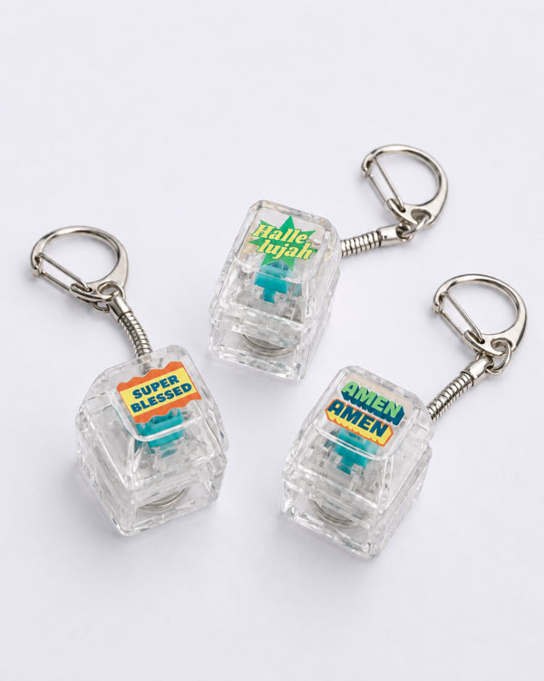 Super Blessed, Hallelujah and Amen Amen light-up keycap keychains shown together
