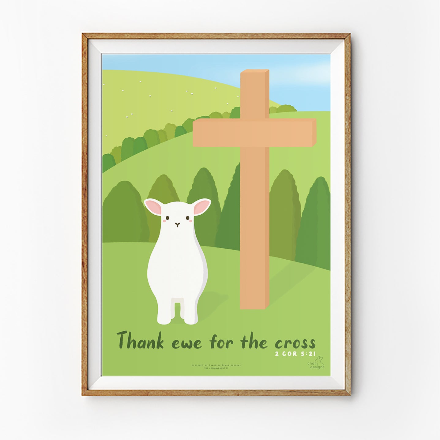 Christian wall art print featuring a cute lamb beside a wooden cross with the phrase “Thank ewe for the cross” inspired by 2 Corinthians 5:21, Charidesigns collaboration.
