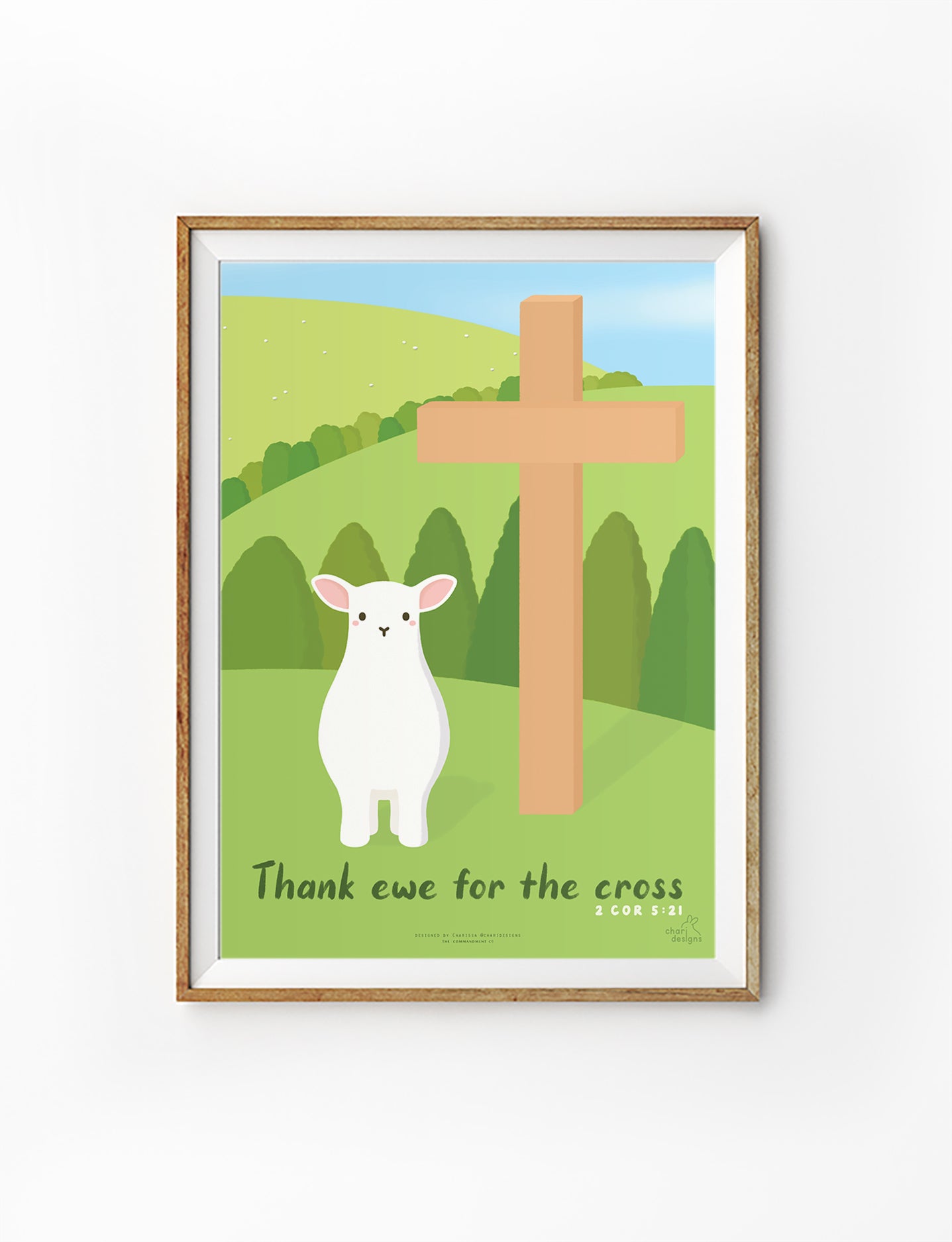 Christian wall art print featuring a cute lamb beside a wooden cross with the phrase “Thank ewe for the cross” inspired by 2 Corinthians 5:21, Charidesigns collaboration.