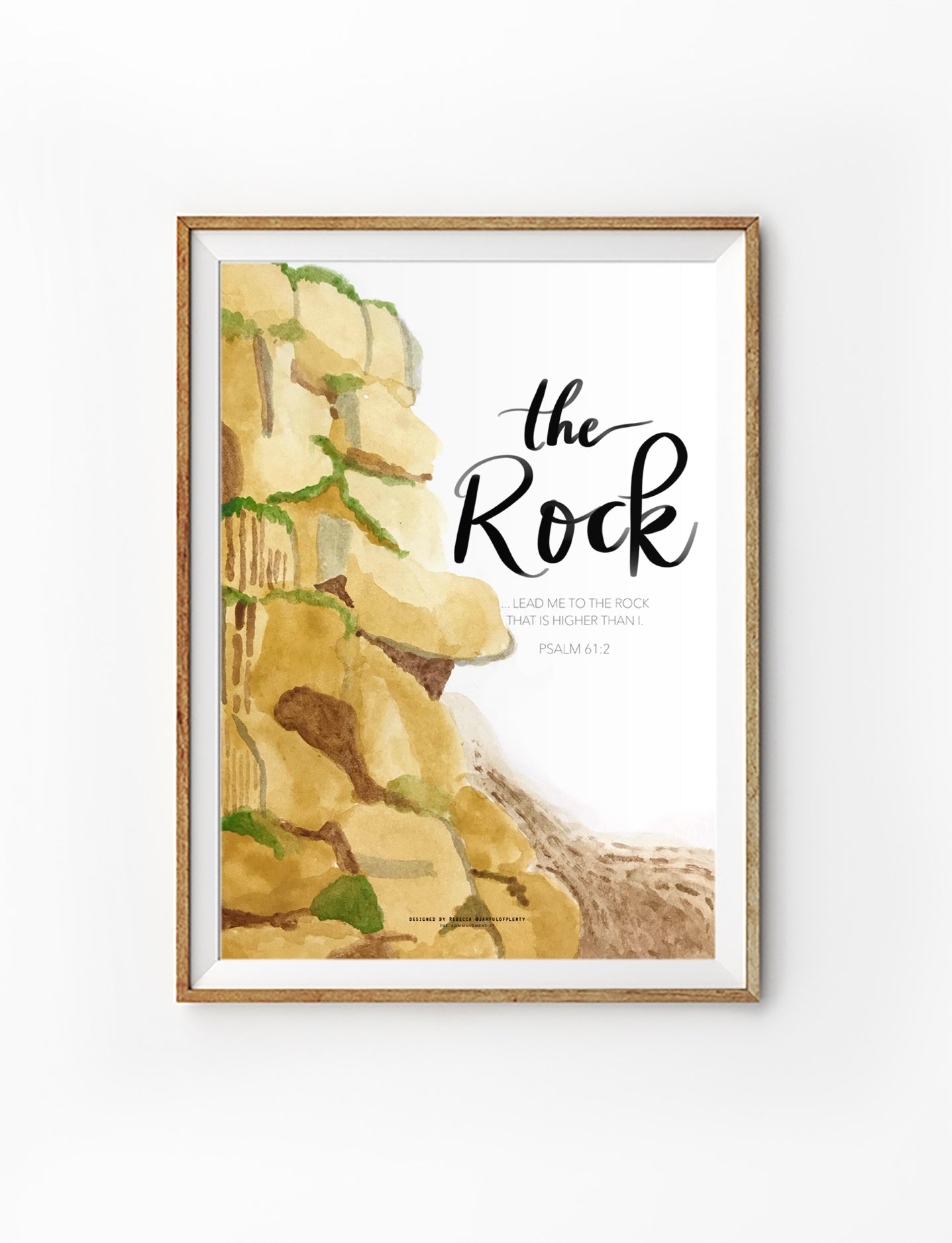 Christian watercolor wall art depicting rocky cliffs with the words ‘The Rock’, inspired by Psalm 61:2 lead me to the rock that is higher than I.