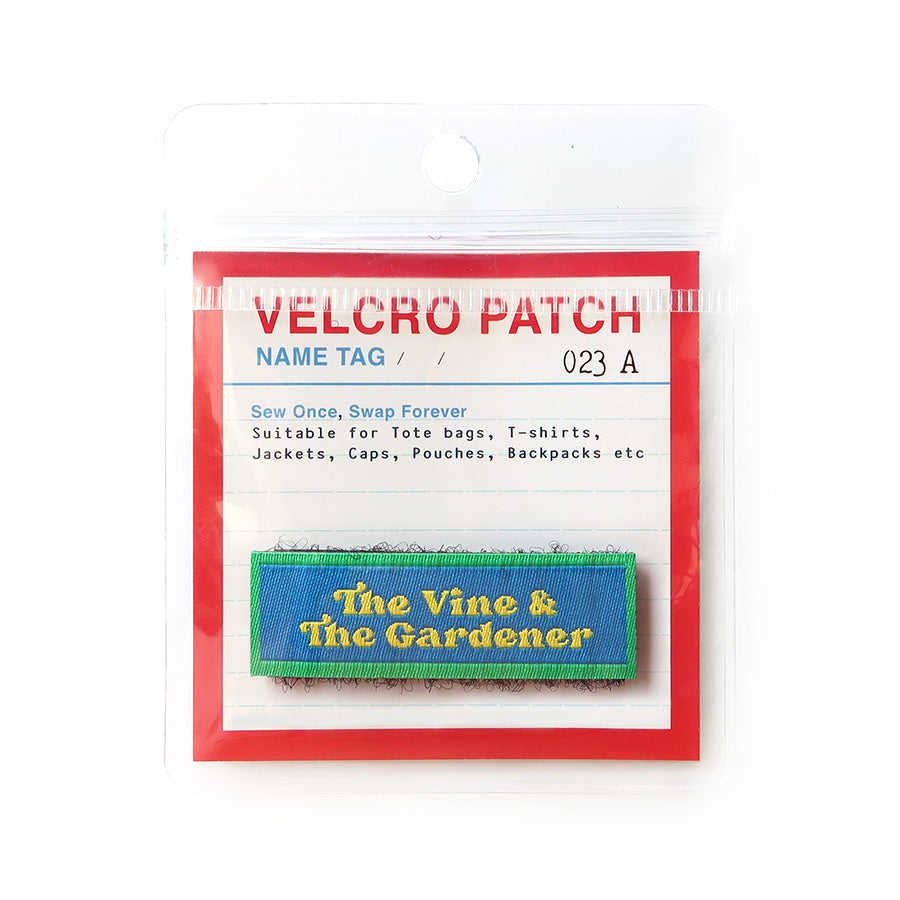 Velcro tag featuring 'The Vine & The Gardener' text in blue and green design, a Christian inspirational patch for apparel and bags
