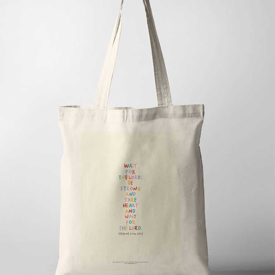 Christian tote bag featuring Psalm 27:14 “Wait for the Lord; be strong and take heart” in colourful hand-lettered text