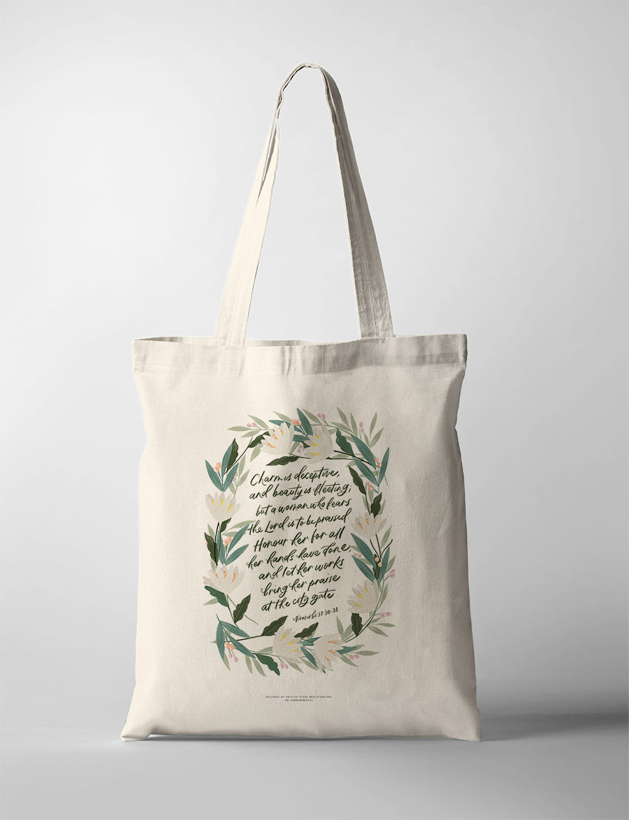 Woman Who Fears the Lord CollabPlus+ tote bag with floral Proverbs 31:30–31 artwork by Kristen Kiong