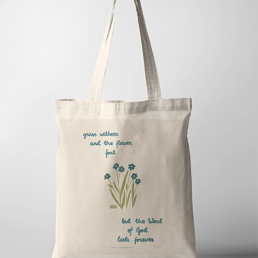 Inspirational Christian tote bag with the words "grass withers and the flower fall, but the Word of God lasts forever," featuring simple blue flowers and green grass, reflecting faith and simple happiness.