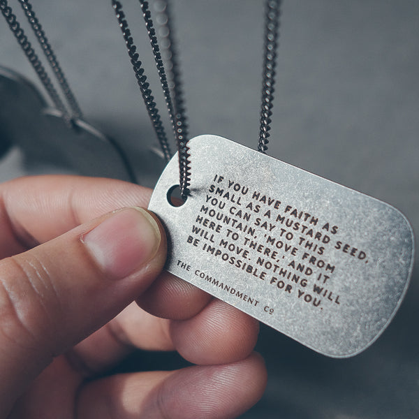 Christian quote and Bible verse engraving examples on gunmetal dog tags