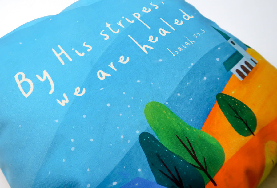 Colourful By His Stripes, We Are Healed Christian cushion cover with cross design.