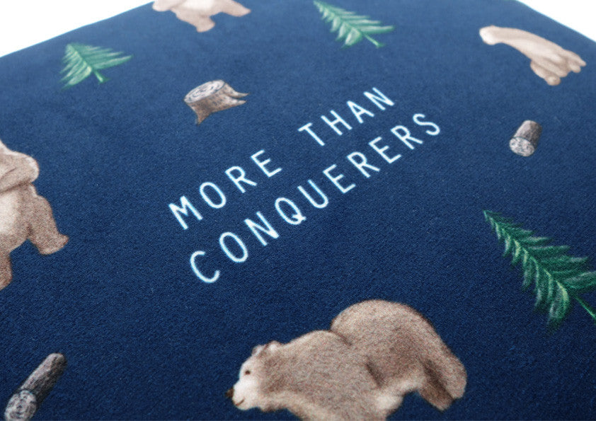 Close-up of the More Than Conquerors Christian cushion cover