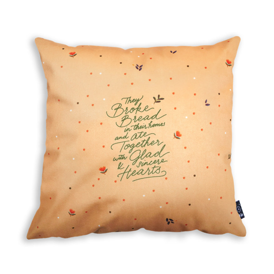 Premium 45cmx45cm pillow cover made of thick super soft velvet, light orange with flower designs. With hidden zip feature. Features verse ‘They broke bread in their homes and ate together with glad and sincere hearts’.