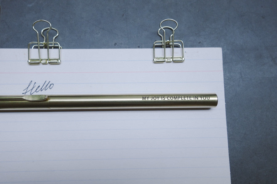 Brass pen barrel with the message 'My joy is complete in you'.