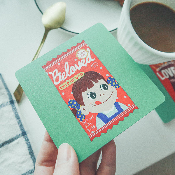 Beloved Child of God wooden Christian coaster beside a drink
