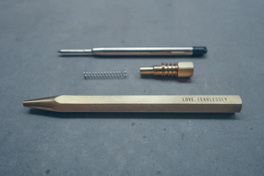 Hex II Classic brass ballpoint pen dismantled components.