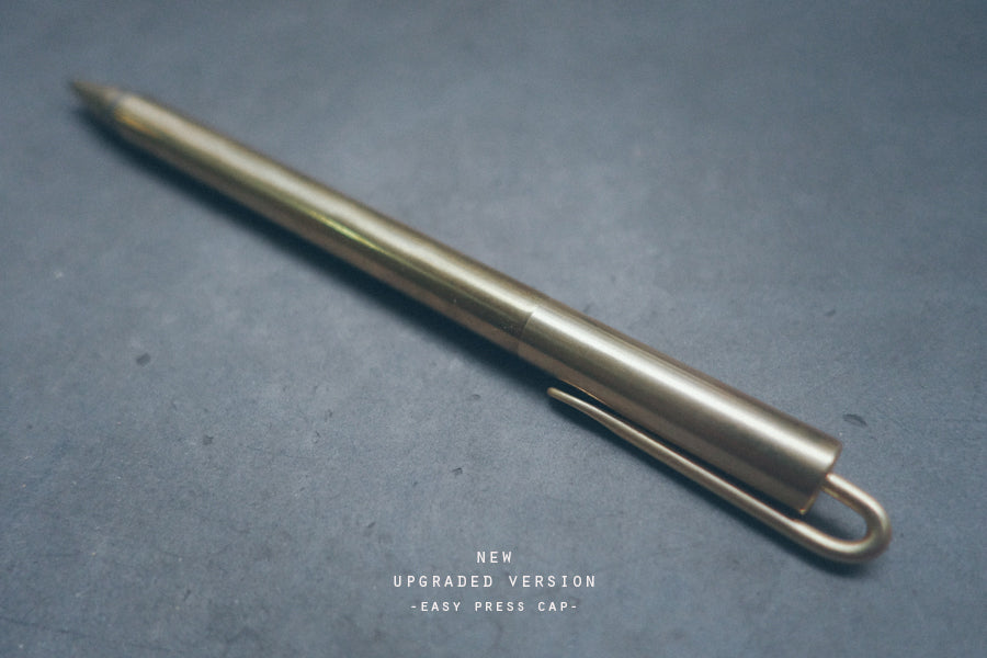Brass pen with easy open press cap