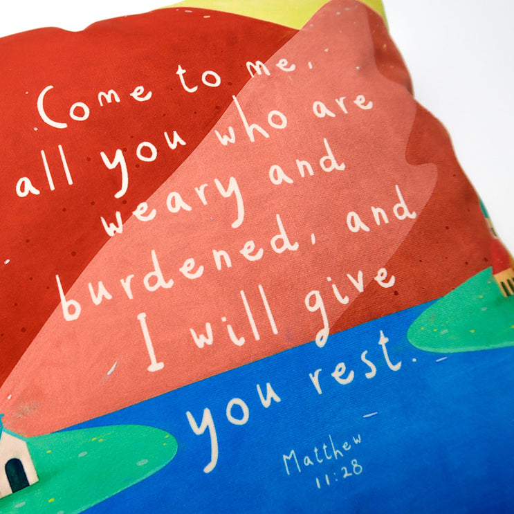Colourful Come to Me Christian cushion cover with Matthew 11:28 wording.