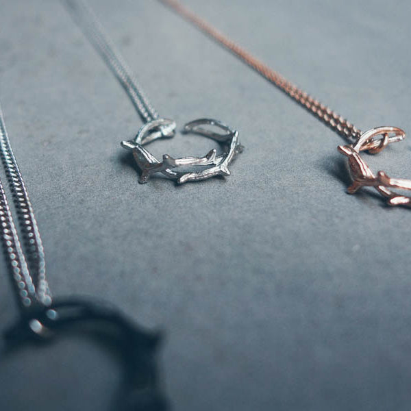 Crown of Thorns ring pendant necklaces in multiple finishes.