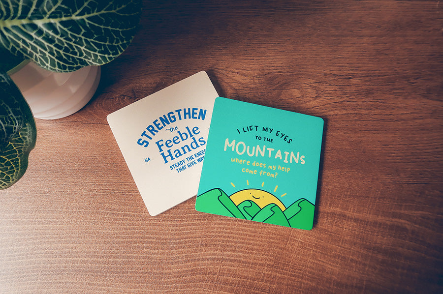 I Lift My Eyes to the Mountains Christian coaster shown in an everyday table setting.