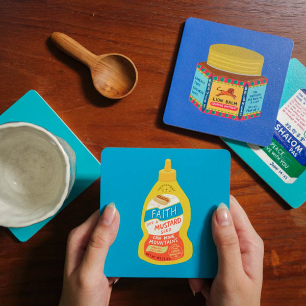 Love Supermarket Christian coaster assortment featuring food-inspired faith designs.