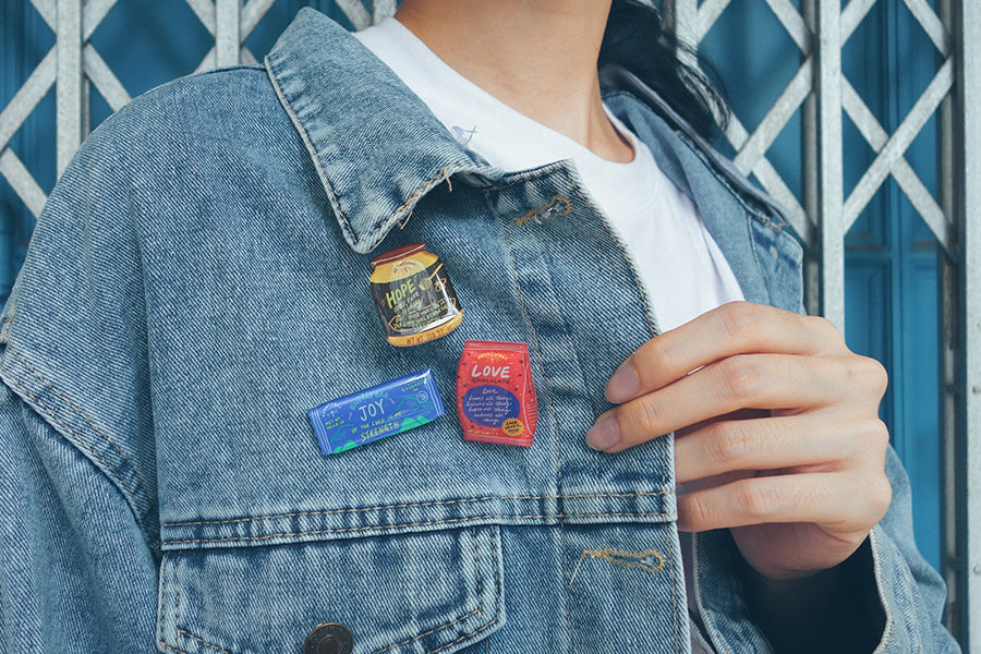 Carry a little positivity wherever you go. Wear the pins out proudly as part of your outfit ensemble.
