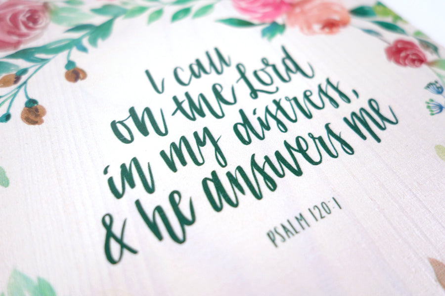 Close up of motivational bible verse ‘I call on the Lord and he answers me’ on white background with roses details digitally printed on 16cmx20cm quality pine wood.