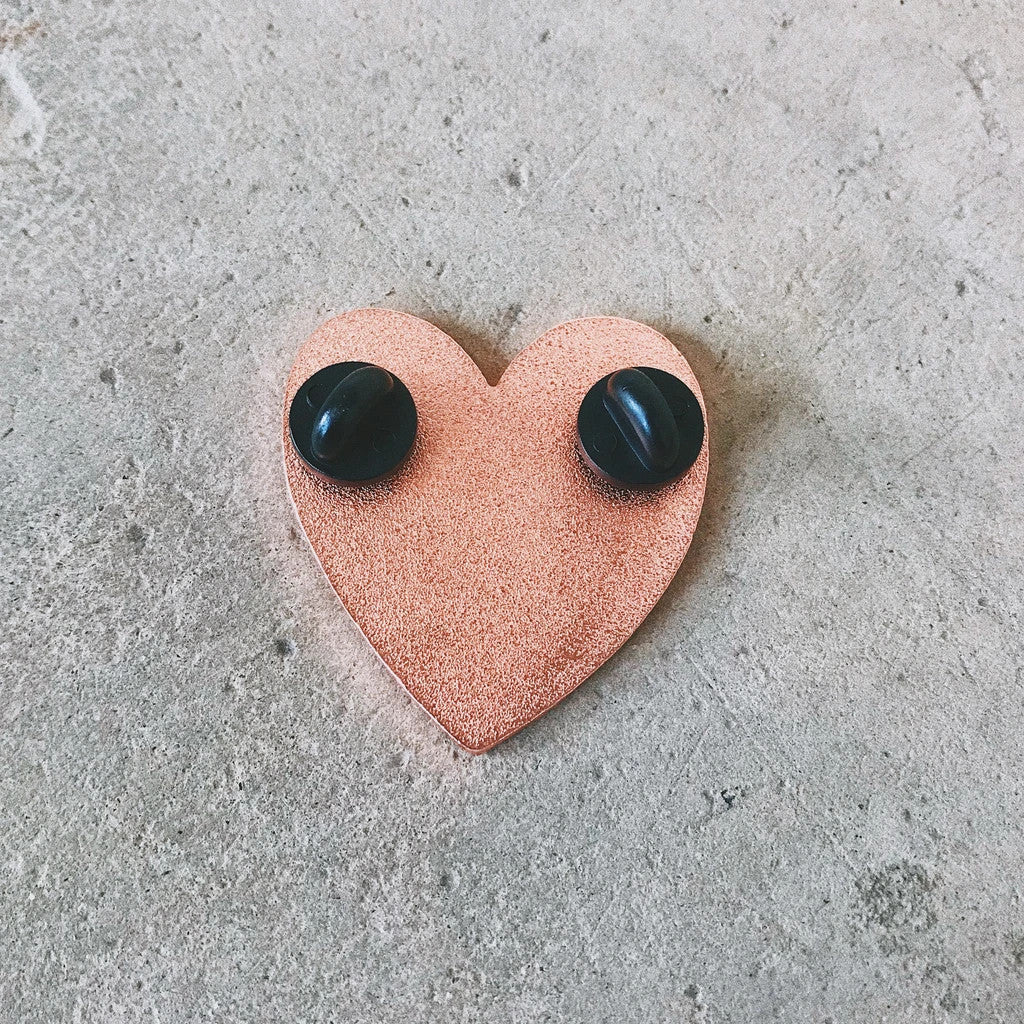 There are two pin backs for more secure pinning onto anything