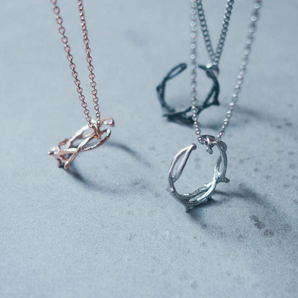 Crown of Thorns stainless-steel Christian necklace and ring-style pendant collection.