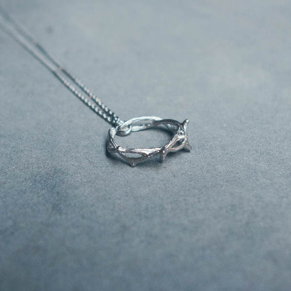 Silver Crown of Thorns ring pendant on chain.