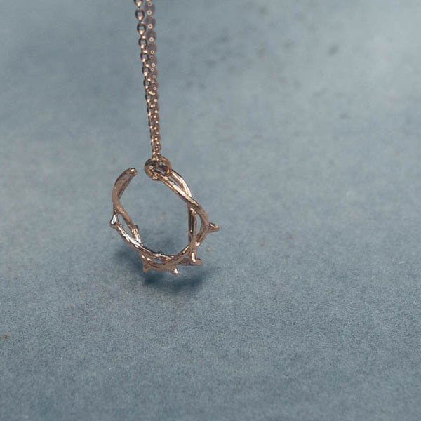 Close-up of Rose Gold Crown of Thorns necklace.