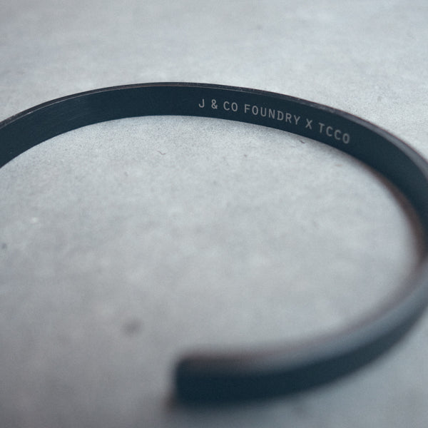 Black plated Verse Band close-up showing engraved faith message.