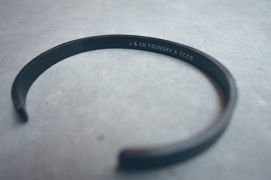 Black plated Verse Band close-up showing engraved faith message.