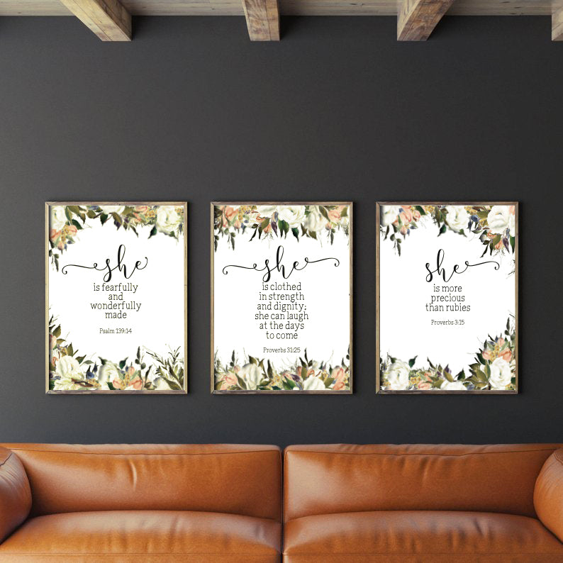 3 A3 posters hung on a blqck wall, rustic living room decor ideas
