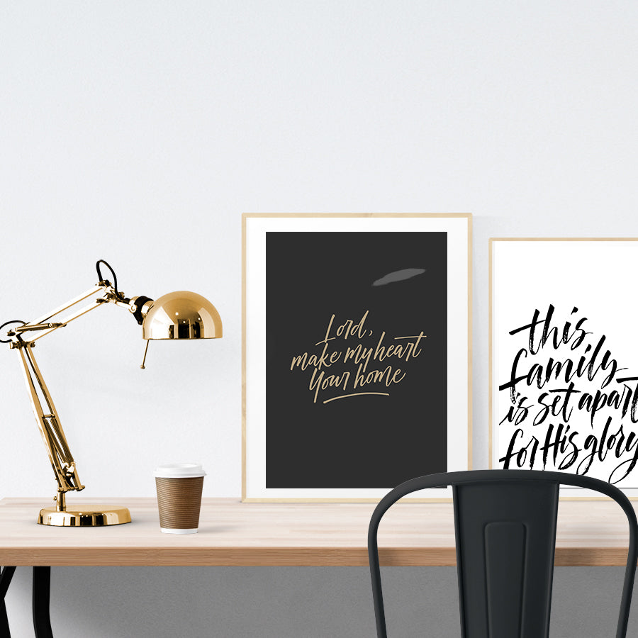 A3 beautiful calligraphy poster placed standing next to a smaller A4 sized calligraphy poster on a wooden table. Modern home interior design ideas.