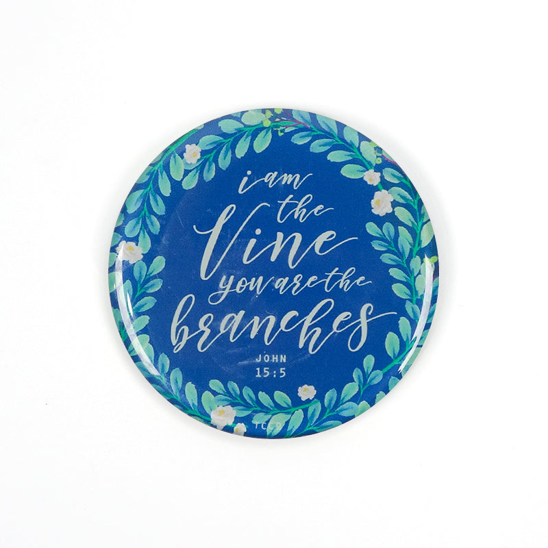 5.5 cm diameter circular Acrylic fridge magnet with bible verse “I am the vine and you are the branches” on foliage background.