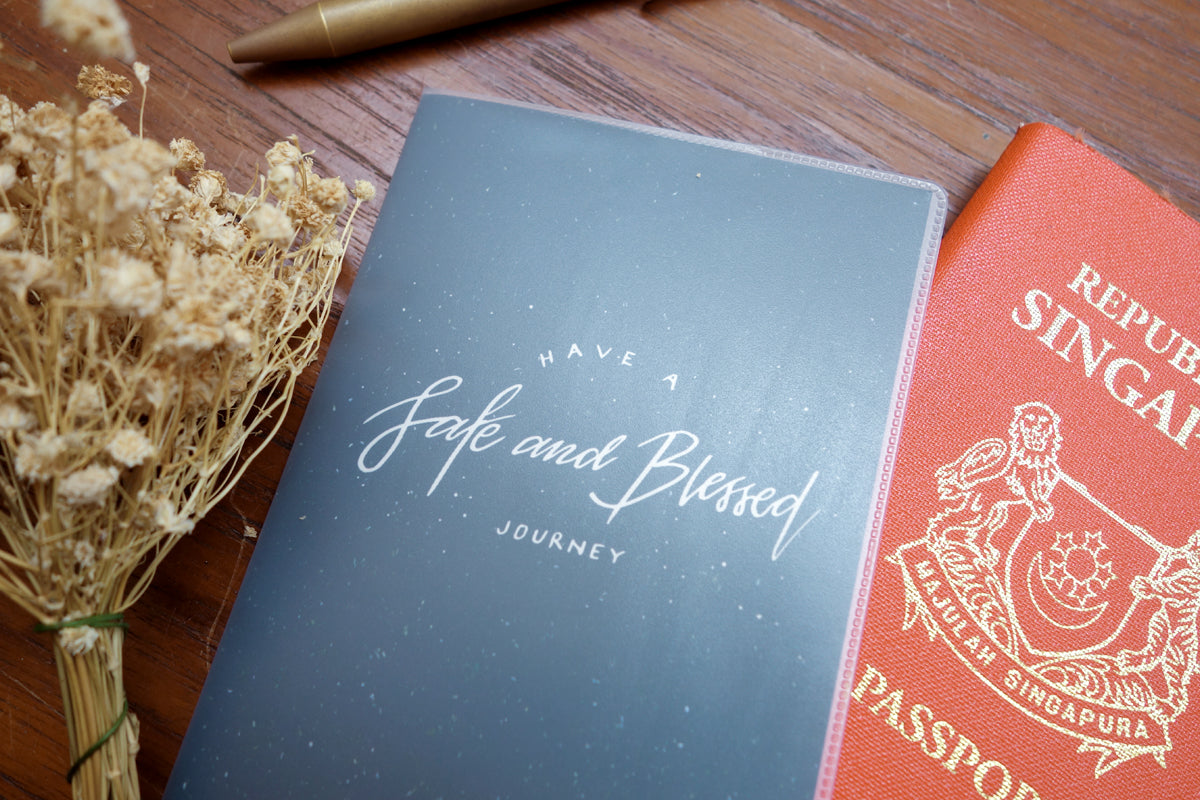 PVC Have A Safe And Blessed Journey passport cover with printed insert.