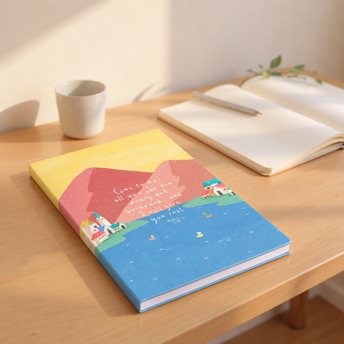 Come To Me A5 Christian notebook on a warm sunlit wooden desk with journalling essentials