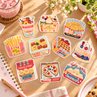 Love Supermarket Frozen Cold faith-inspired food vinyl stickers arranged individually on a sunlit desk