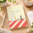 Jalan-Jalan With Jesus A6 Christian notebook styled on a bright wooden desk with stationery and a coffee cup