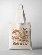 Canvas Christian tote bag with playful apple and juice illustration and the verse “Do it all for the glory of God” from 1 Corinthians 10:31