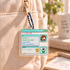 Messenger Chat with Jesus acrylic keychain hanging from a cream bag zipper with the blue bead chain threaded through the keychain hole