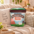 Divine Ice Cream Christian plush toy styled smaller among cosy neutral cushions in a warm sunlit living room