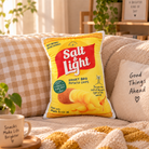 Salt and Light Potato Chips Christian plush toy styled smaller on a cosy neutral sofa in warm natural light
