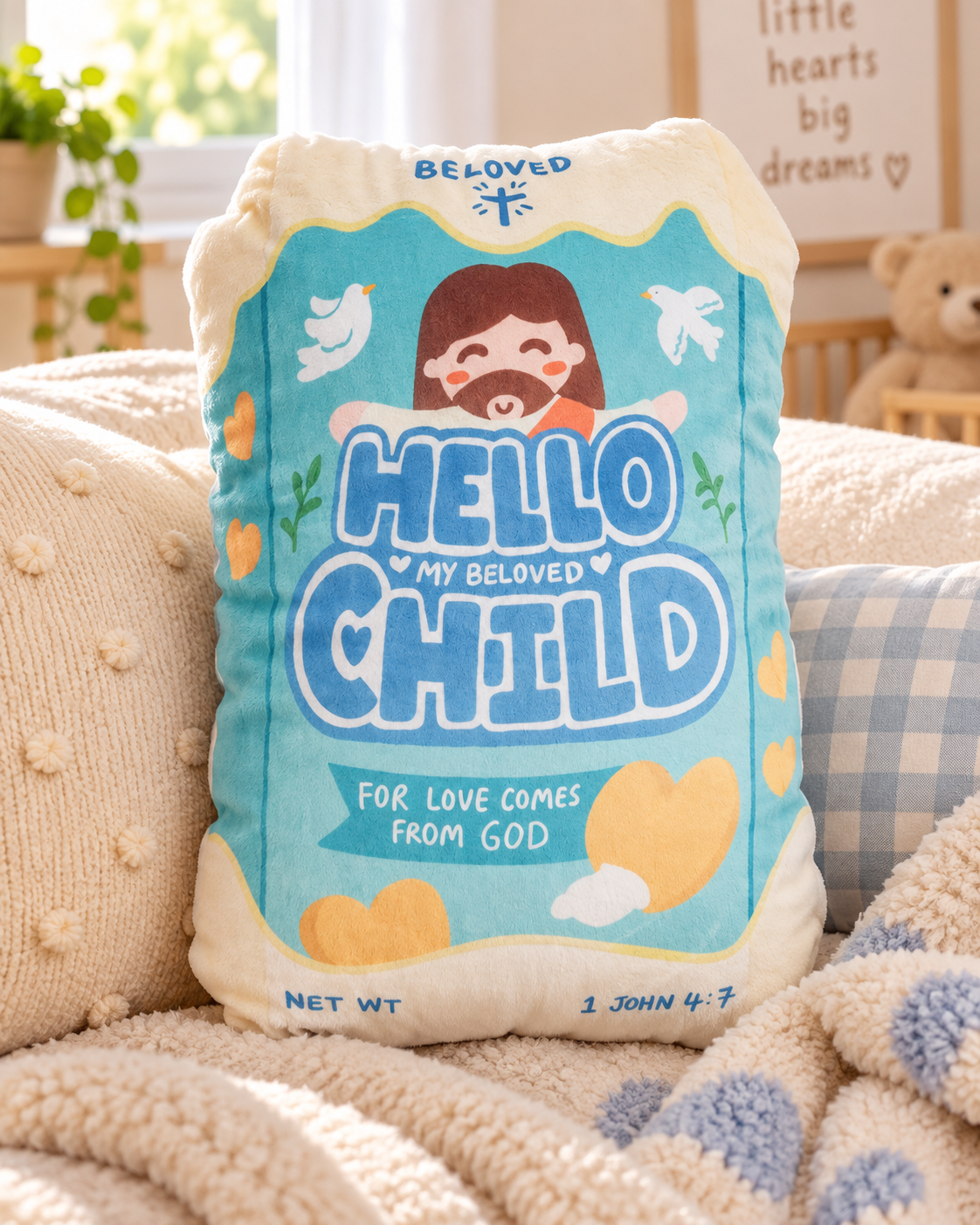 Hello My Beloved Child Christian biscuit plush toy styled on a cosy sofa with neutral cushions in warm natural light