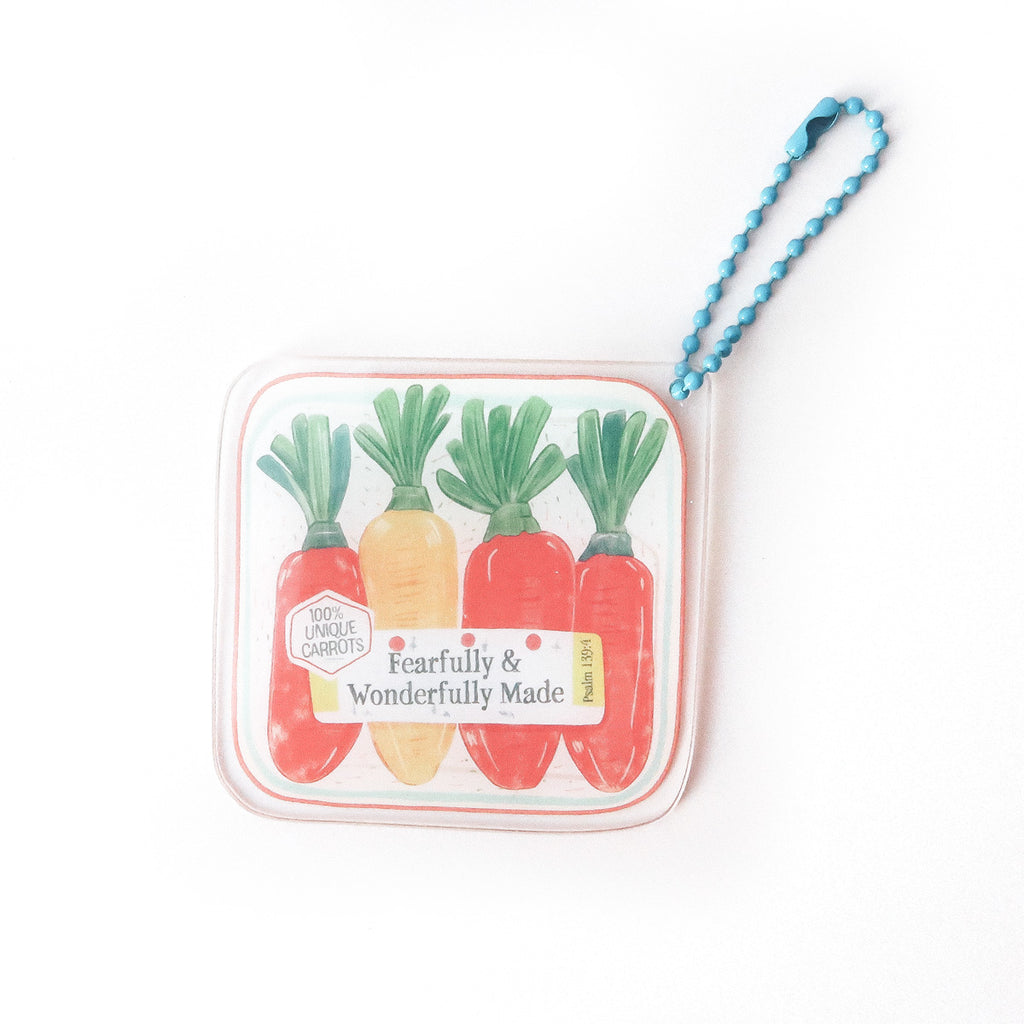 Keychain featuring colorful carrots with the phrase ‘Fearfully & Wonderfully Made’ and Psalm 139:14, symbolizing uniqueness and faith.