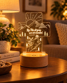 We Are Healed Isaiah 53:5 Christian night light glowing on a thick wooden base in a warm cosy living room