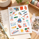 Art Everyday Christian sticker sheet styled on a bright journalling desk with notebook, coffee, washi tape and stationery