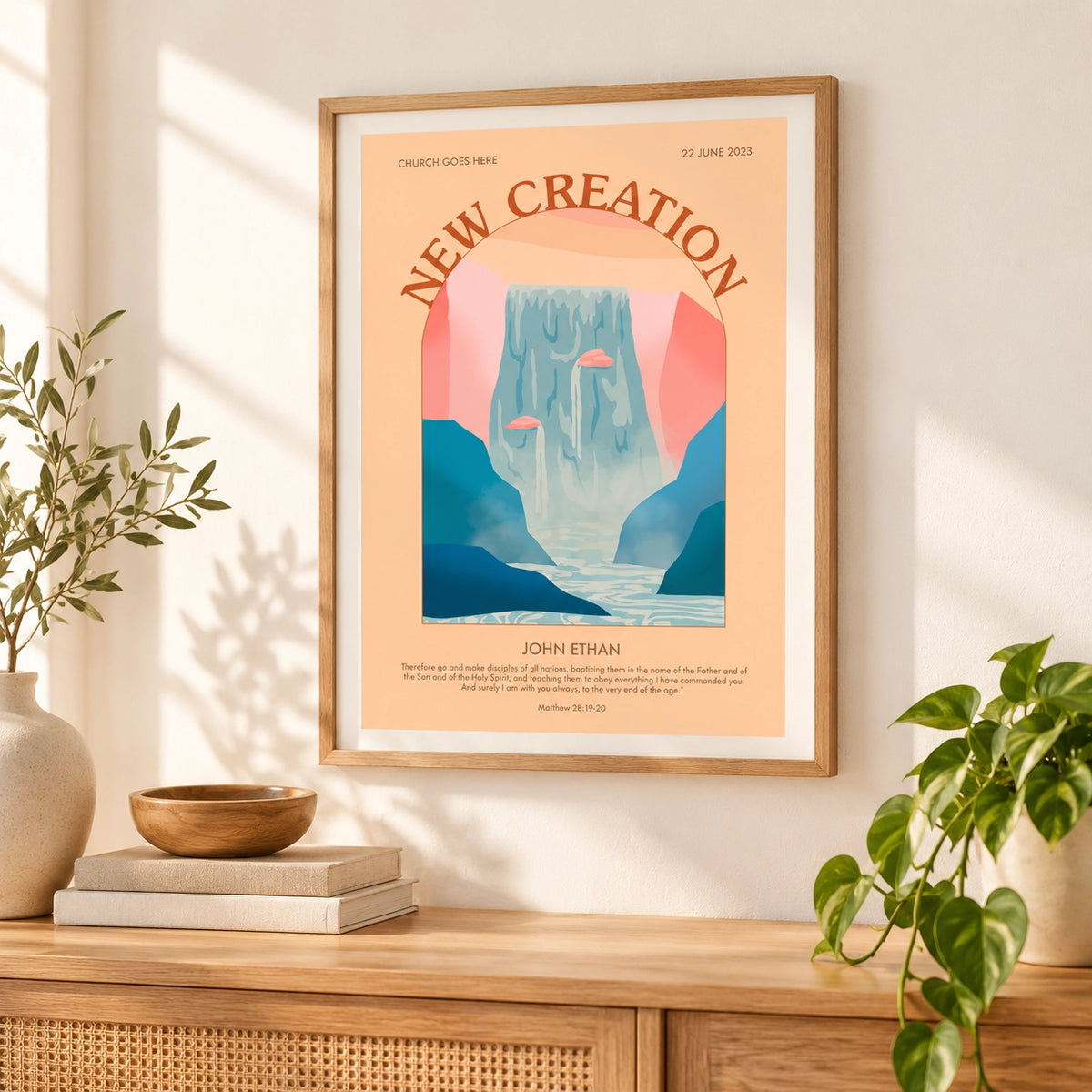 Customisable New Creation baptism poster displayed in a wooden frame in a bright natural home interior