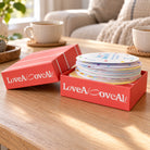 Love Above All 40 Days Love Challenge bilingual conversation card set styled on a warm coffee table